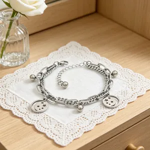Detailed view of a silver stainless steel double-layered bracelet with star charms