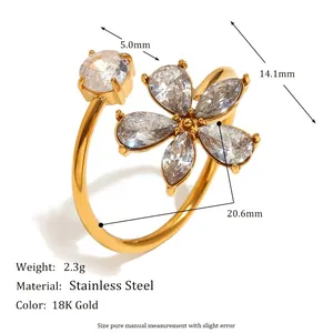 Detailed view of an 18K gold plated stainless steel flower ring with white crystals