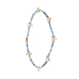 Oceaan-geïnspireerde kralenketting met zeesterren en blauwe glazen en stenen kralen