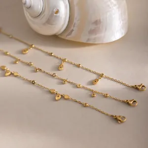 Elegante conjunto de tobilleras de acero inoxidable bañadas en oro de 18k y circon