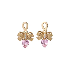 Elegant gold-plated bow earrings featuring dangling pink heart-shaped zircon stones for women