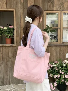 Large capacity pink canvas tote bag with bow embroidery and long shoulder strap, stylish