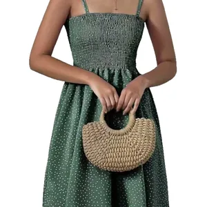 Summer bohemian green polka dot cami beach dress with smocked bodice details.