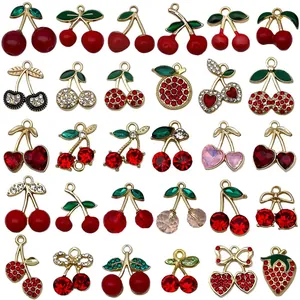 Diverse collection of sweet red cherry and strawberry alloy charms with sparkling rhinestones