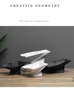 Modern minimalist geometric ceramic pedestal trays in matte black and white finishes