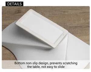 Detail view of the functional anti-slip unglazed bottom of a white ceramic pedestal tray