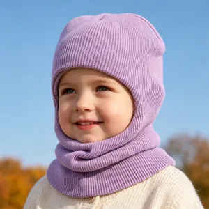 Close-up of a child wearing a purple knitted balaclava hat in autumn outdoors
