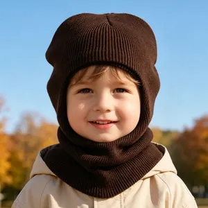 Detailed shot of a child wearing a cozy brown knitted balaclava hat for winter warmth