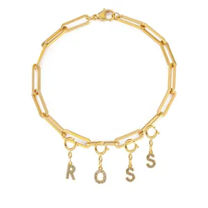 Gold stainless steel paperclip chain bracelet with stone-encrusted ROSS letter charms