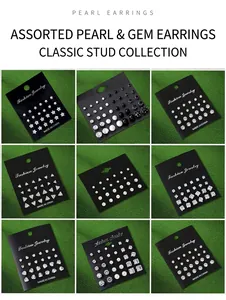 Macro view of 12-pair zircon and pearl stud earring sets on black display cards