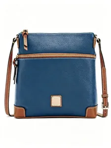 Elegant blue pebbled leather crossbody bag with vintage brown trim and gold hardware