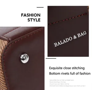 Detailansicht der feinen Nähte und Metallnieten am Boden der braunen Lederhandtasche