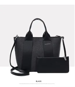 Professionelle Studioaufnahme eines schwarzen Handtaschen-Sets mit Shopper und Beutel