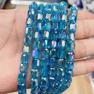 Macro view of 8x9mm blue cylindrical crystal glass beads with AB coating for DIY jewelry