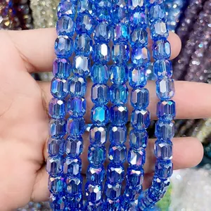 Macro detail of faceted 8*9mm cylindrical blue glass crystal beads for DIY jewelry.