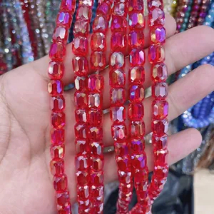 Close-up of faceted red cylindrical crystal glass beads for DIY jewelry making
