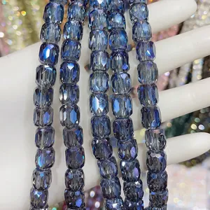 Macro view of faceted 8x9mm dark blue cylindrical glass crystal beads for DIY