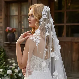 Detailed view of a 3-meter long bridal veil with 3D floral appliqués and pearls