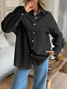 Casual black long-sleeved button-down shirt for women featuring a loose fit design.