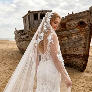 Back view detail of sheer cathedral wedding veil with 3D floral lace and pearl accents