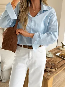Light blue long-sleeved casual linen shirt for women in a lifestyle fashion setting