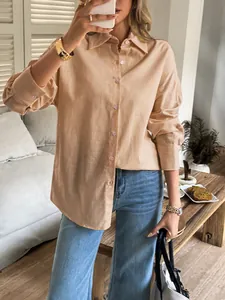 Detailed view of the premium fabric texture and classic buttoned cuffs on shirt