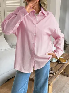 Elegant women's pink long-sleeve button-down casual shirt with a soft texture