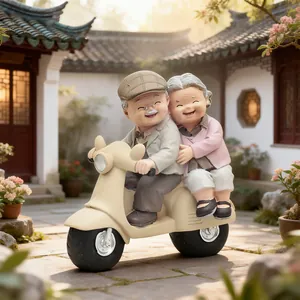 Handcrafted resin figurine of a happy elderly couple riding a vintage scooter together