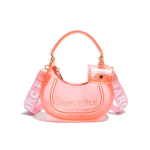 Modern pink transparent jelly dumpling shoulder bag with Marc Eliza logo and wide strap