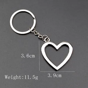 Minimalist silver heart-shaped hollow metal keychain with dimension and weight display