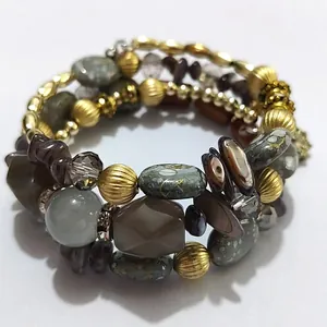 Close-up view of retro multi-layer beaded wrap bracelet with stone and shell details