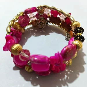 Bohemian vintage wrap bracelet with vibrant pink stones and gold-tone beaded details