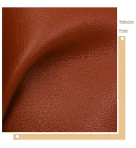 Close-up detail of high-quality brown pebble-grain leather texture on vintage handbag