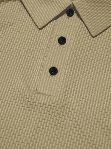 Close-up of men's heavy waffle knit polo shirt with button-down collar in khaki.