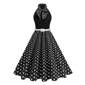 Elegant Audrey Hepburn style black and white polka dot halter dress with bow belt