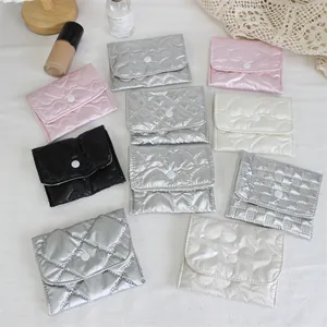Detailed view of colorful quilted heart-pattern mini PU pouches.