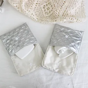 Detailed view of silver quilted PU mini storage bags showing their interior capacity