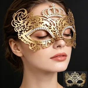 Detailed view of elegant gold metal masquerade mask with crown and rhinestones