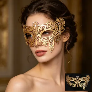 Detailed gold metal filigree masquerade mask with sparkling rhinestones worn by a model