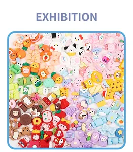 Close-up of mixed cartoon resin charms for DIY phone case and accessory decoration