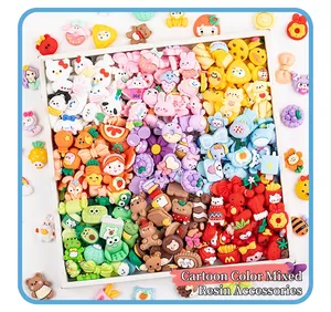 Detailed macro view of colorful cartoon resin charms sorted by color in a wooden tray.