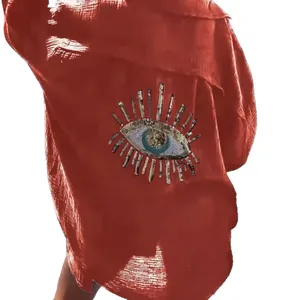 Orange double-layered wrinkled cotton shirt with sequined evil eye detail on back