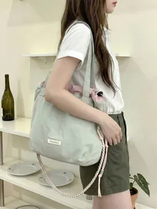Stylish Korean style canvas tote bag with large capacity and braided crossbody strap