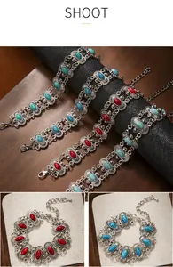 Detail of bohemian vintage bracelets with turquoise and red stones in antique silver finish