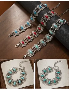 Detail view of Bohemian vintage turquoise and red stone bracelets in silver