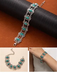 Detailed view of bohemian vintage turquoise bracelet with ornate silver-tone links