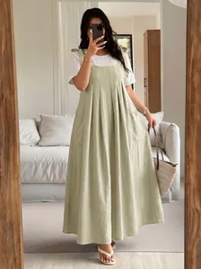 Trendy plus size sage green pleated pinafore maxi dress with white t-shirt for women