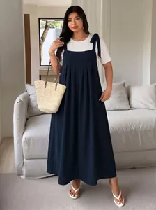 Plus size navy blue pleated suspender maxi dress styled with a white short sleeve tee