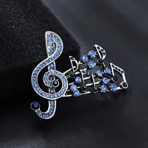 Vintage silver musical note brooch with sparkling blue and black rhinestones for women