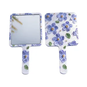 Floral handheld portable makeup mirror with blue flower pattern and square design